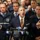 Patrolmen’s Benevolent Association President Patrick J. Lynch, left, speaks with the media at the Bronx Criminal Court after NYPD Lt. Jose Gautreaux, who was shot in the arm by a gunman who opened fire in a police precinct in the Bronx, was released from Lincoln Hospital, Monday, Feb. 10, 2020, in New York.